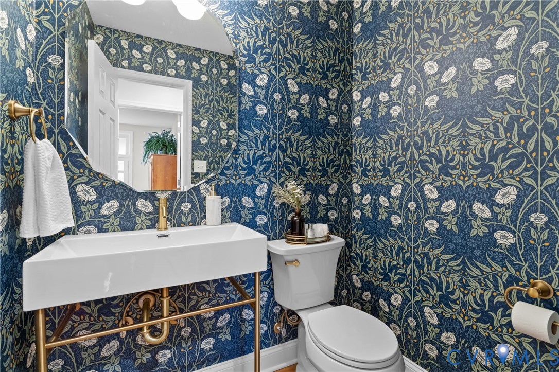 1017 Ridge Top Road Henrico, VA 23229 - Photo 14 of 37 a bathroom with a sink toilet and mirror