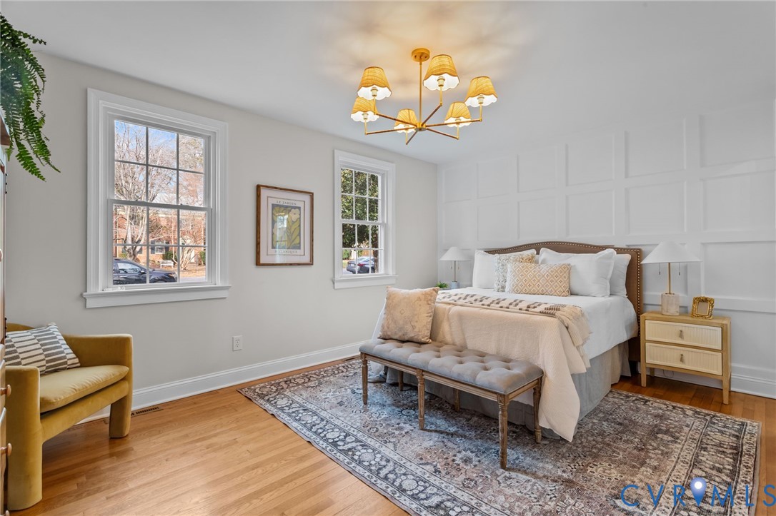 1017 Ridge Top Road Henrico, VA 23229 - Photo 15 of 37 a bedroom with a bed and a chandelier