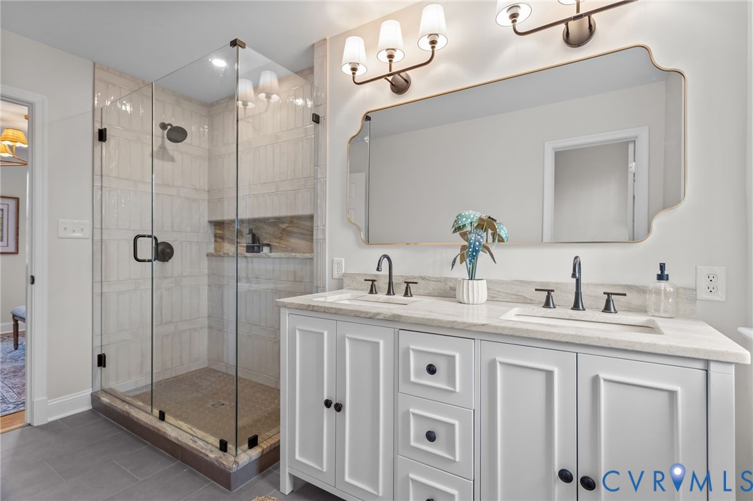 1017 Ridge Top Road Henrico, VA 23229 - Photo 19 of 37 a bathroom with a granite countertop sink mirror and shower