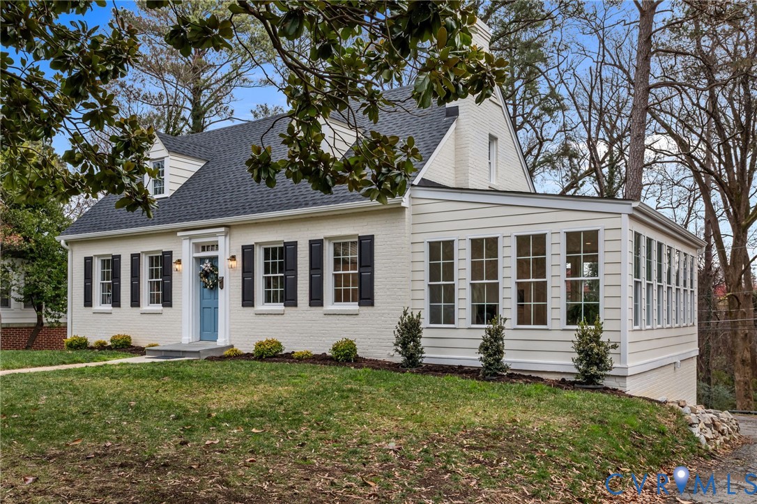 1017 Ridge Top Road Henrico, VA 23229 - Photo 2 of 37 a front view of a house with a garden