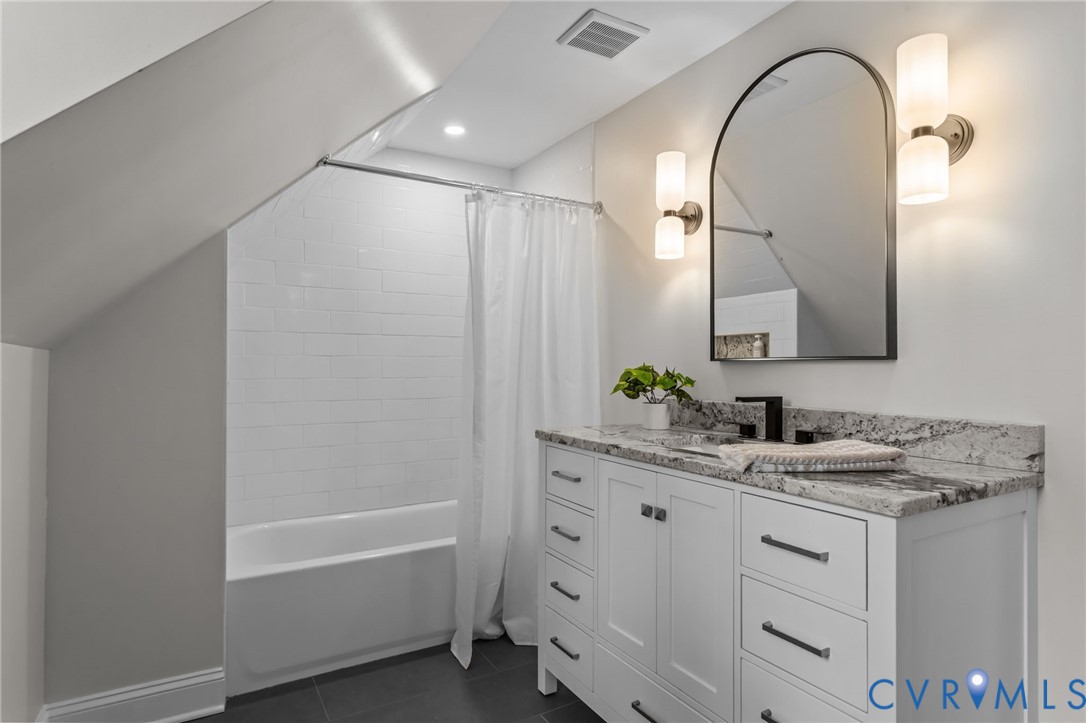 1017 Ridge Top Road Henrico, VA 23229 - Photo 23 of 37 a bathroom with a sink and a mirror