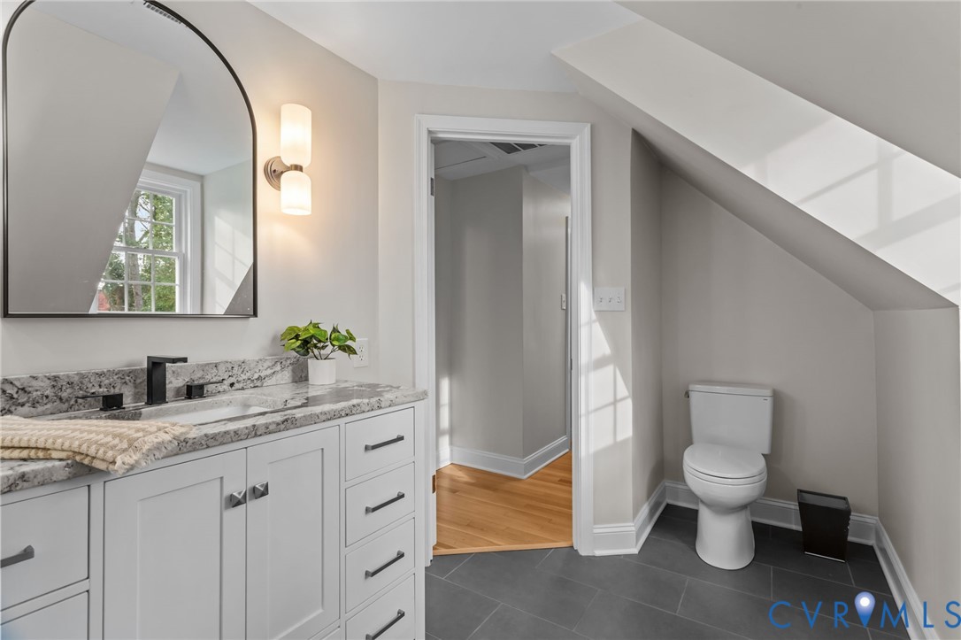 1017 Ridge Top Road Henrico, VA 23229 - Photo 24 of 37 a bathroom with a granite countertop toilet sink and mirror
