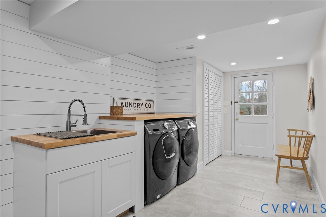 1017 Ridge Top Road Henrico, VA 23229 - Photo 32 of 37 a utility room with sink dryer and washer