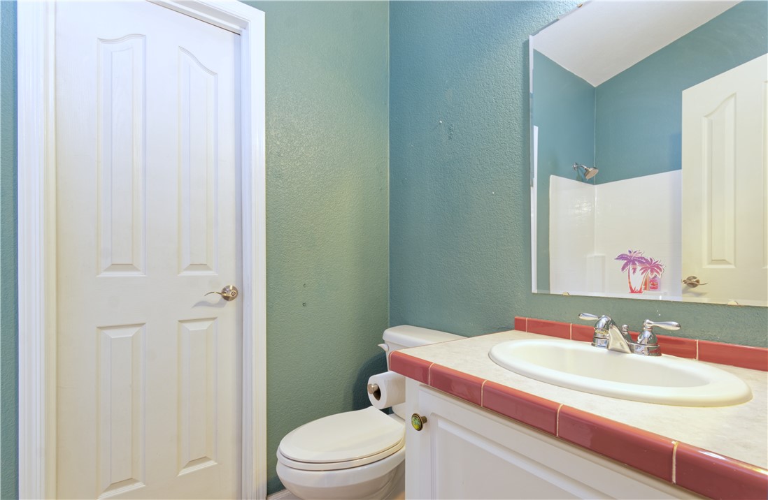 49603 Rainbow Avenue Quartzsite, AZ 85346 - Photo 25 of 44 Bathroom with a textured wall, vanity, and a shower