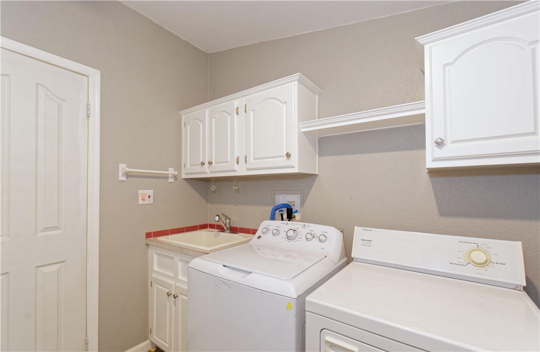 49603 Rainbow Avenue Quartzsite, AZ 85346 - Photo 27 of 44 Laundry room with cabinet space and washer and dryer