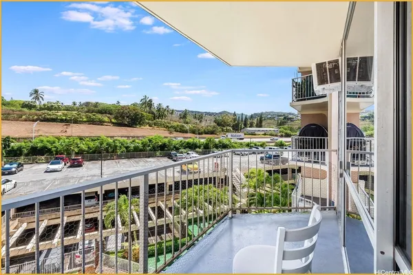 a balcony with outdoor view