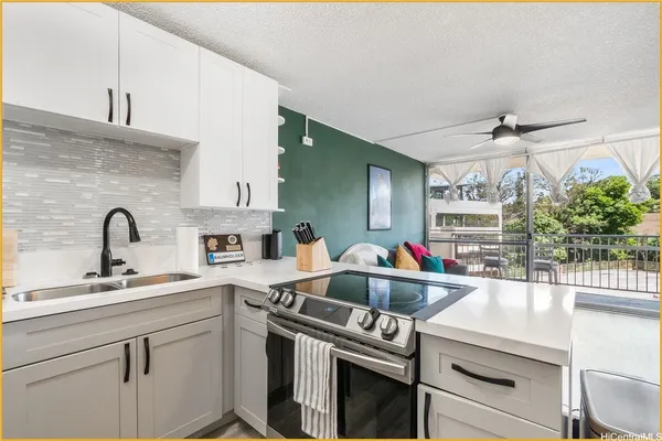 a kitchen with cabinets a sink and appliances