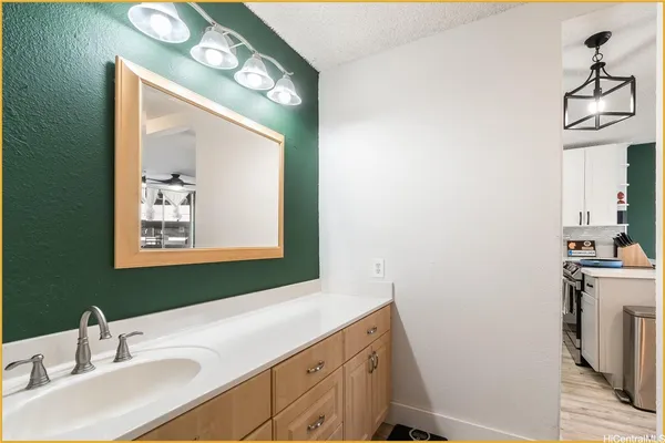 a bathroom with a toilet sink and shower