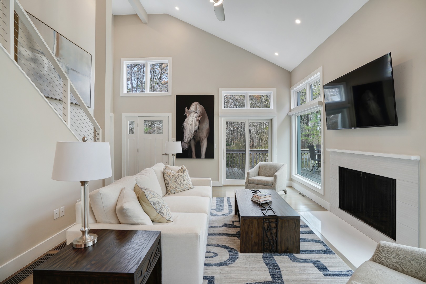 150 Cove Road, Unit 10 Vineyard Haven, MA 02568 - Photo 4 of 45 Light-filled living area with wood fireplace.