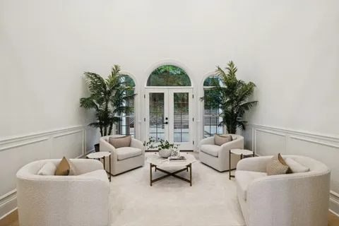 a view of a balcony with wooden floor