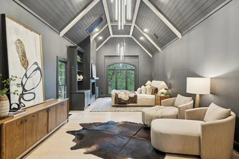 a bathroom with a sink a toilet a mirror a bathtub and shower