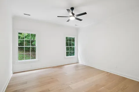 a bedroom with furniture and a fireplace