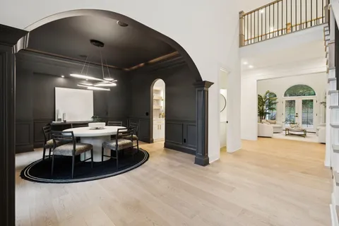 a kitchen with a table and chairs in it