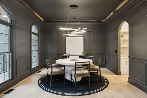 a kitchen with a refrigerator and a sink