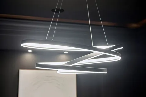 a living room with fireplace furniture and a chandelier