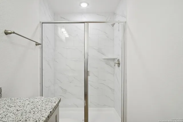 a view of an empty room and a window