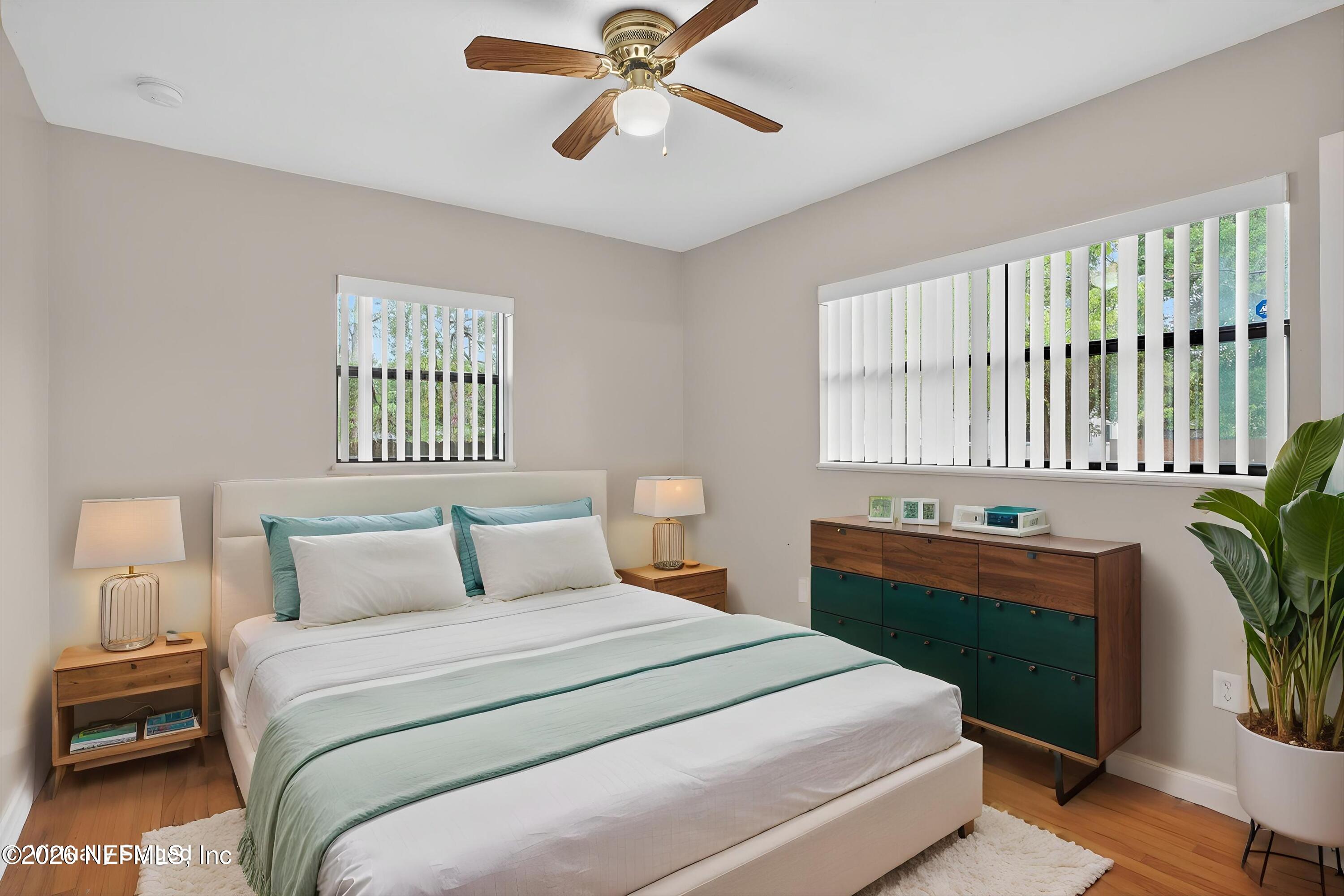 4231 Rendale Drive North Jacksonville, FL 32210 - Photo 14 of 37 a bedroom with a bed and a chandelier