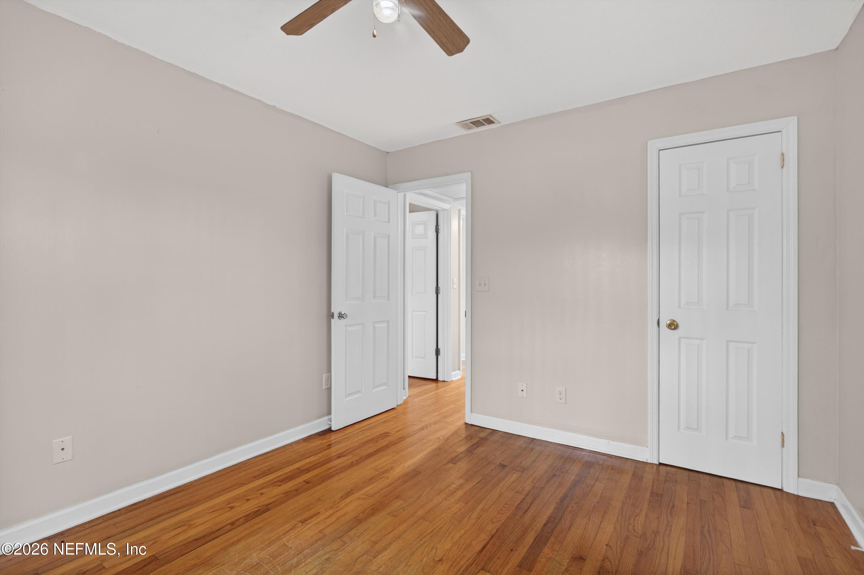 4231 Rendale Drive North Jacksonville, FL 32210 - Photo 21 of 37 a view of an empty room with wooden floor