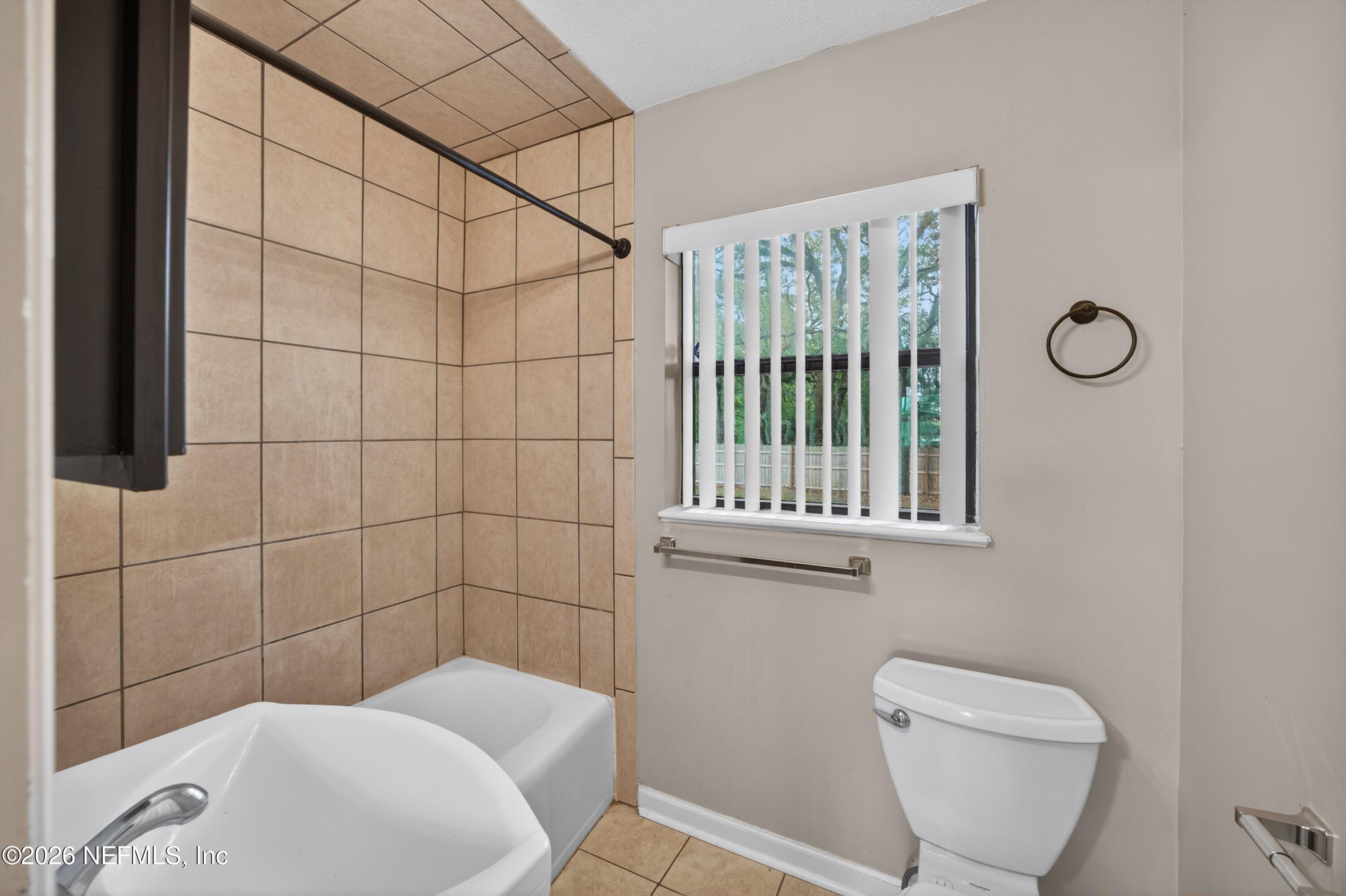 4231 Rendale Drive North Jacksonville, FL 32210 - Photo 23 of 37 a bathroom with a toilet and a shower