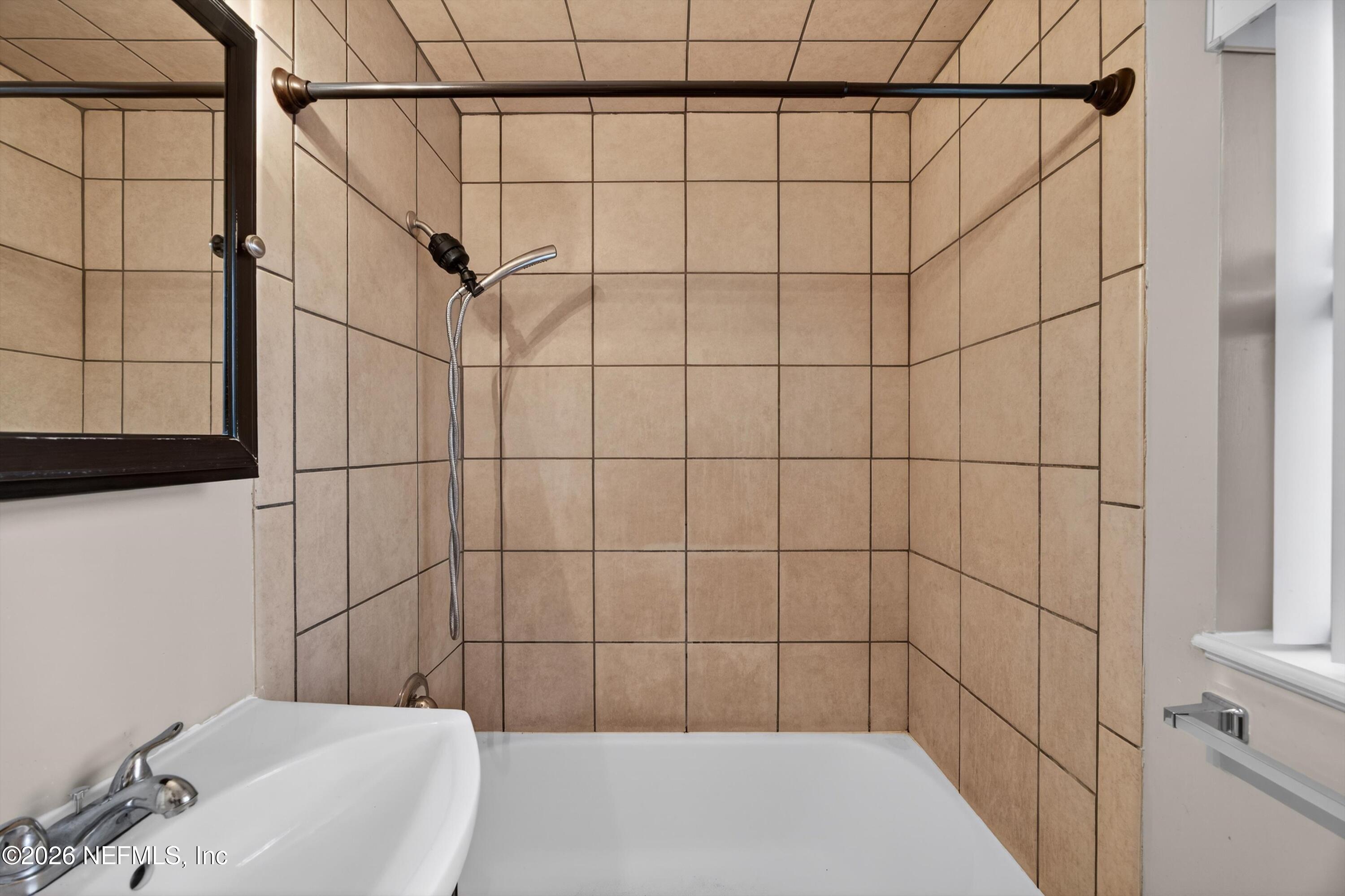 4231 Rendale Drive North Jacksonville, FL 32210 - Photo 24 of 37 a bathroom with a bathtub and shower