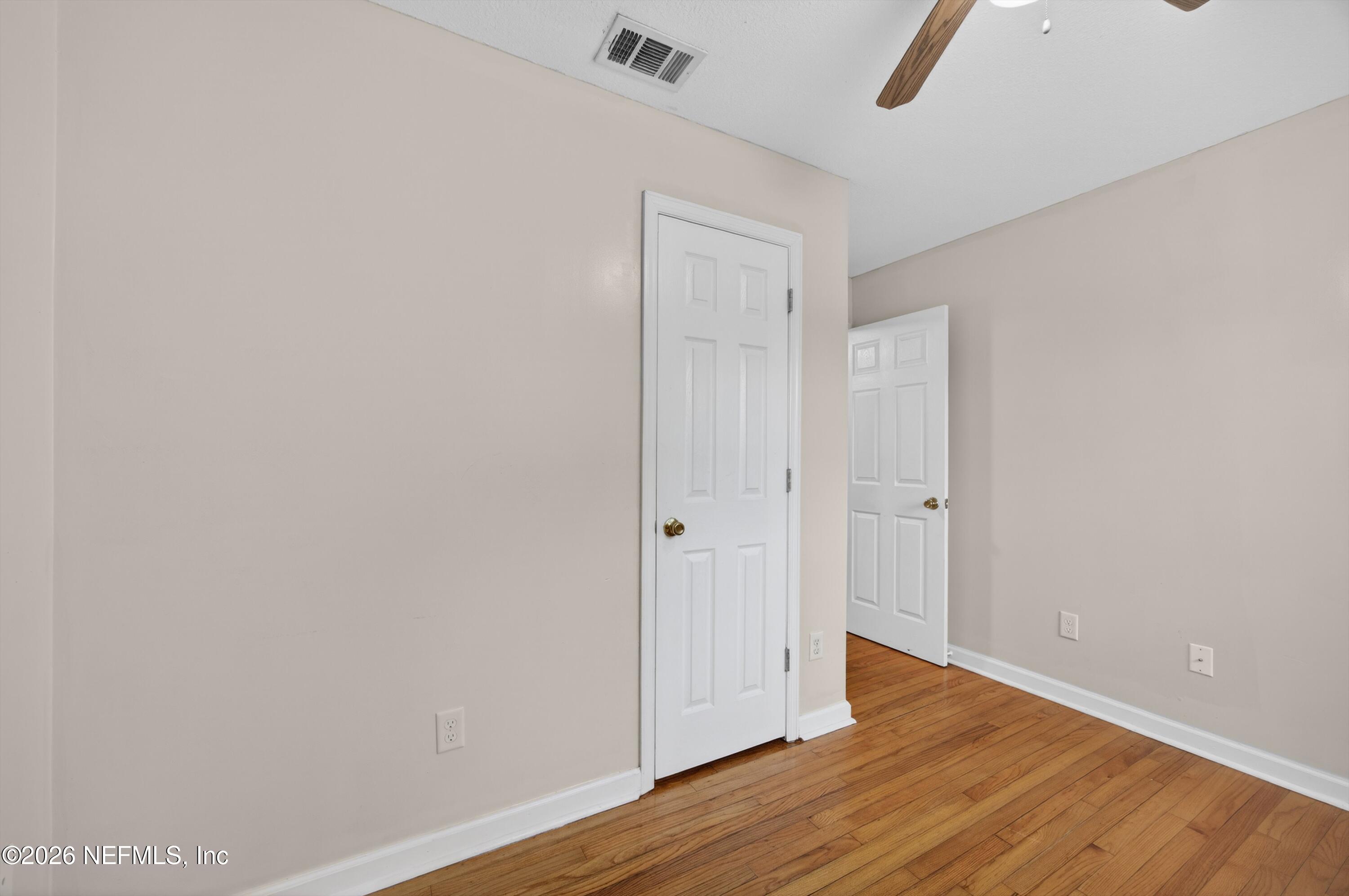4231 Rendale Drive North Jacksonville, FL 32210 - Photo 28 of 37 a view of an empty room with wooden floor