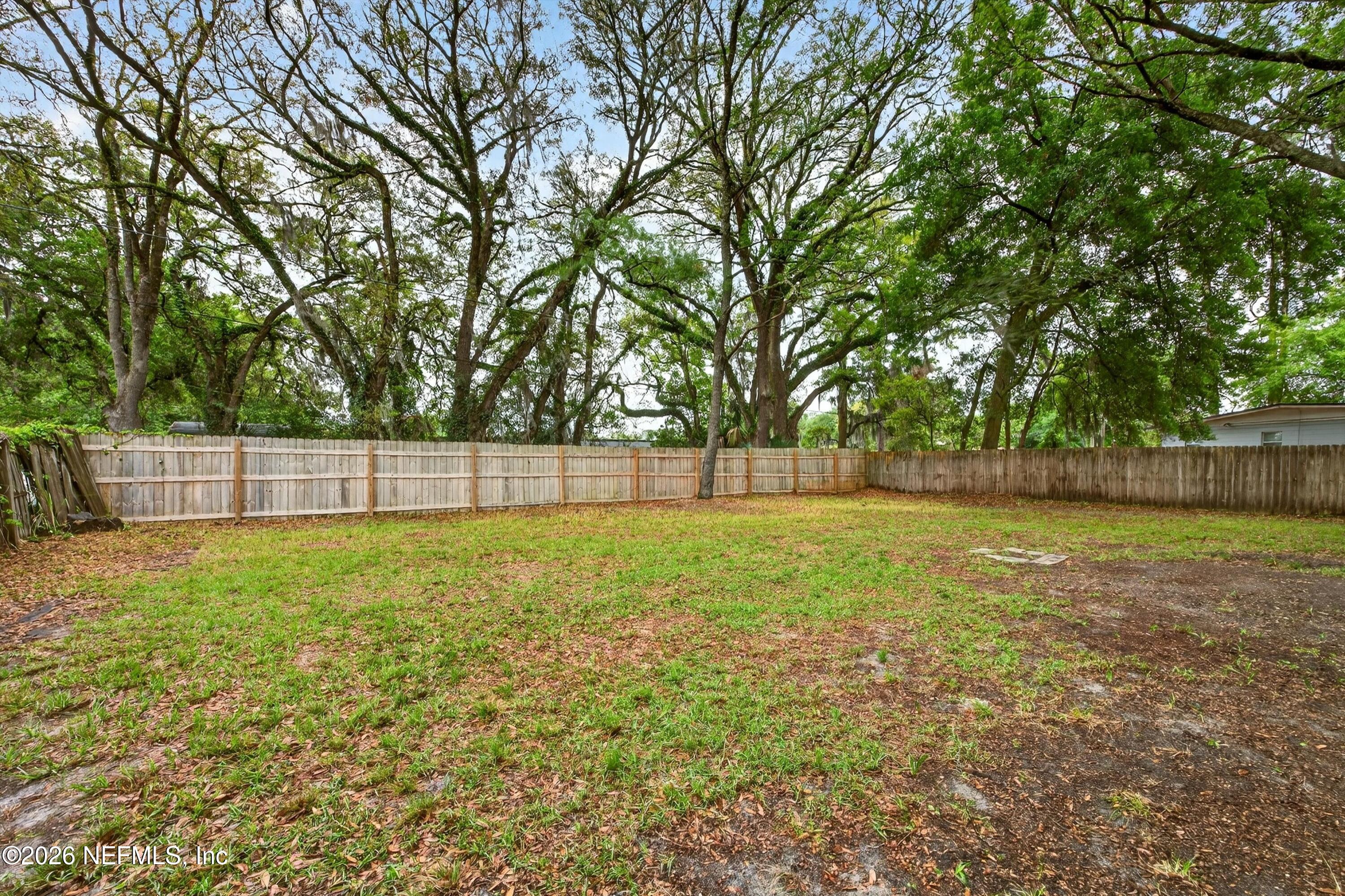 4231 Rendale Drive North Jacksonville, FL 32210 - Photo 33 of 37 a view of outdoor space with deck and yard
