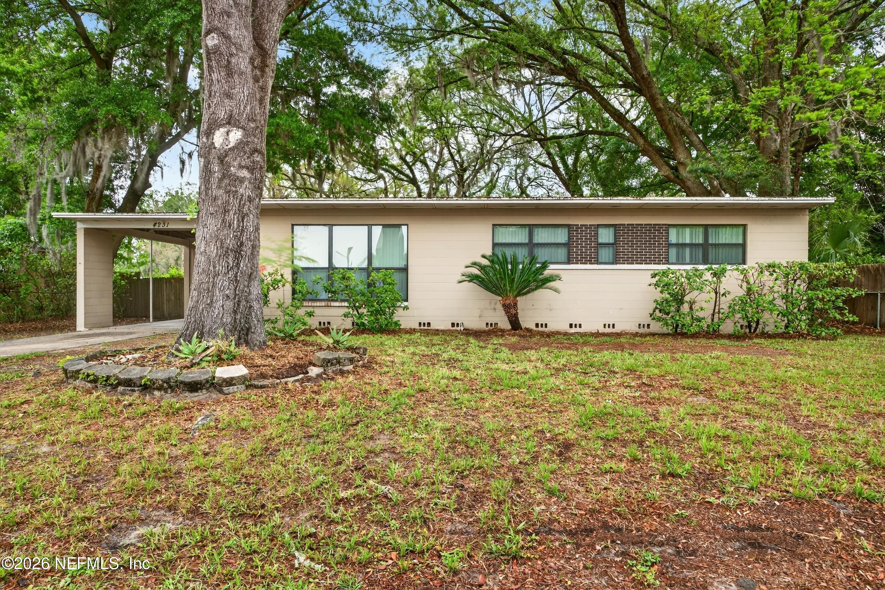 4231 Rendale Drive North Jacksonville, FL 32210 - Photo 7 of 37 front view of a house with a yard