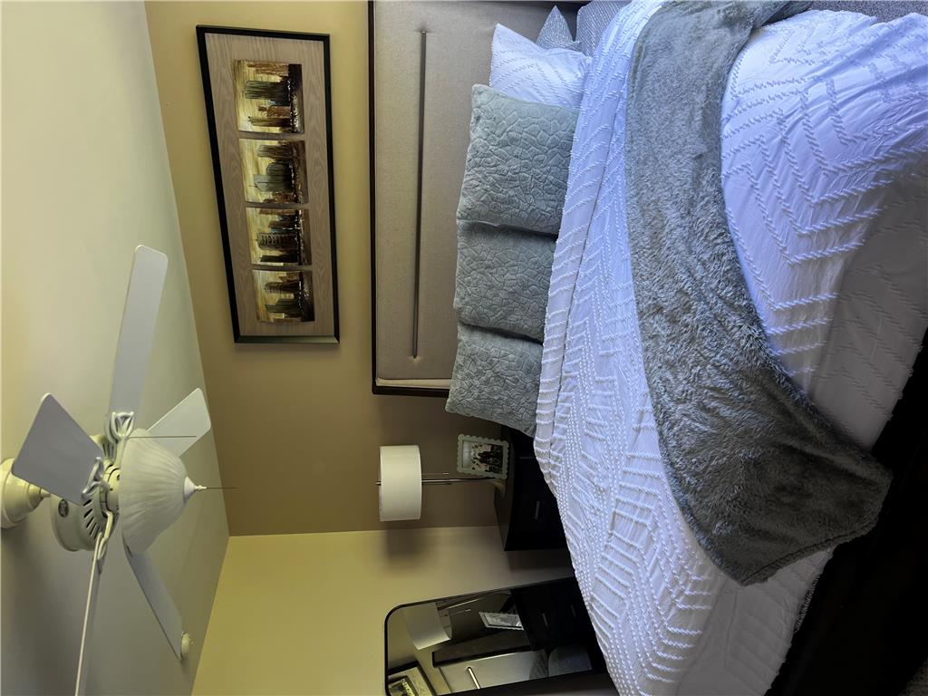 8549 Gateway Road Breinigsville, PA 18031 - Photo 18 of 26 A well-lit bedroom offering a restful retreat with a modern aesthetic.