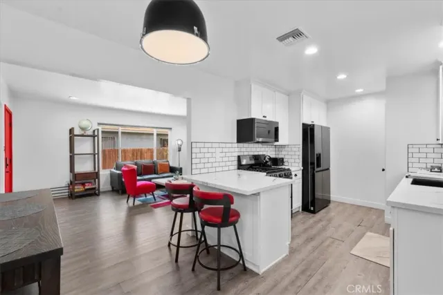 a bedroom with a bed and a chair