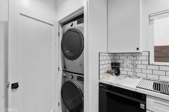 a view of storage and utility room with washer and dryer