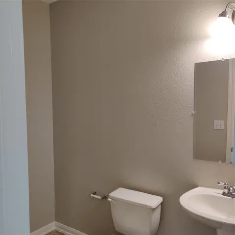 a kitchen with granite countertop a stove a sink and a granite counter tops