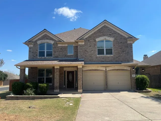 a front view of a house with yard