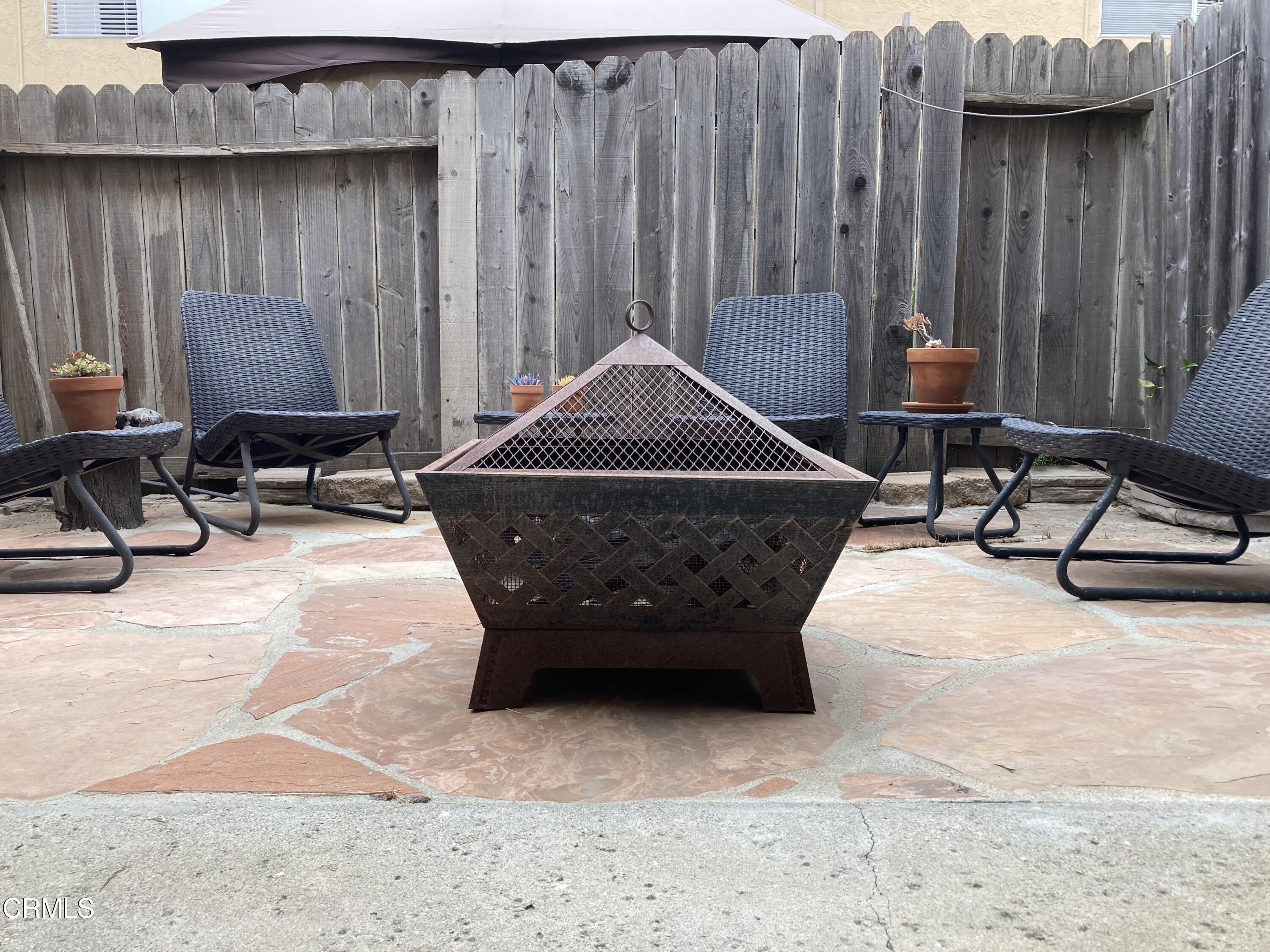 5130 West Wooley Road, Unit 2 Oxnard, CA 93035 - Photo 11 of 11 a room with furniture a rug and a window