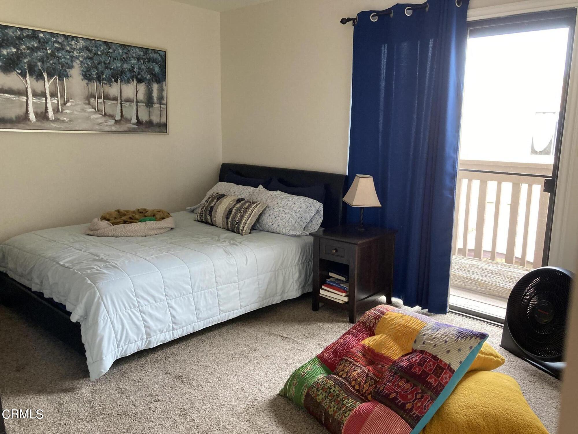 5130 West Wooley Road, Unit 2 Oxnard, CA 93035 - Photo 8 of 11 a bedroom with bed and a window
