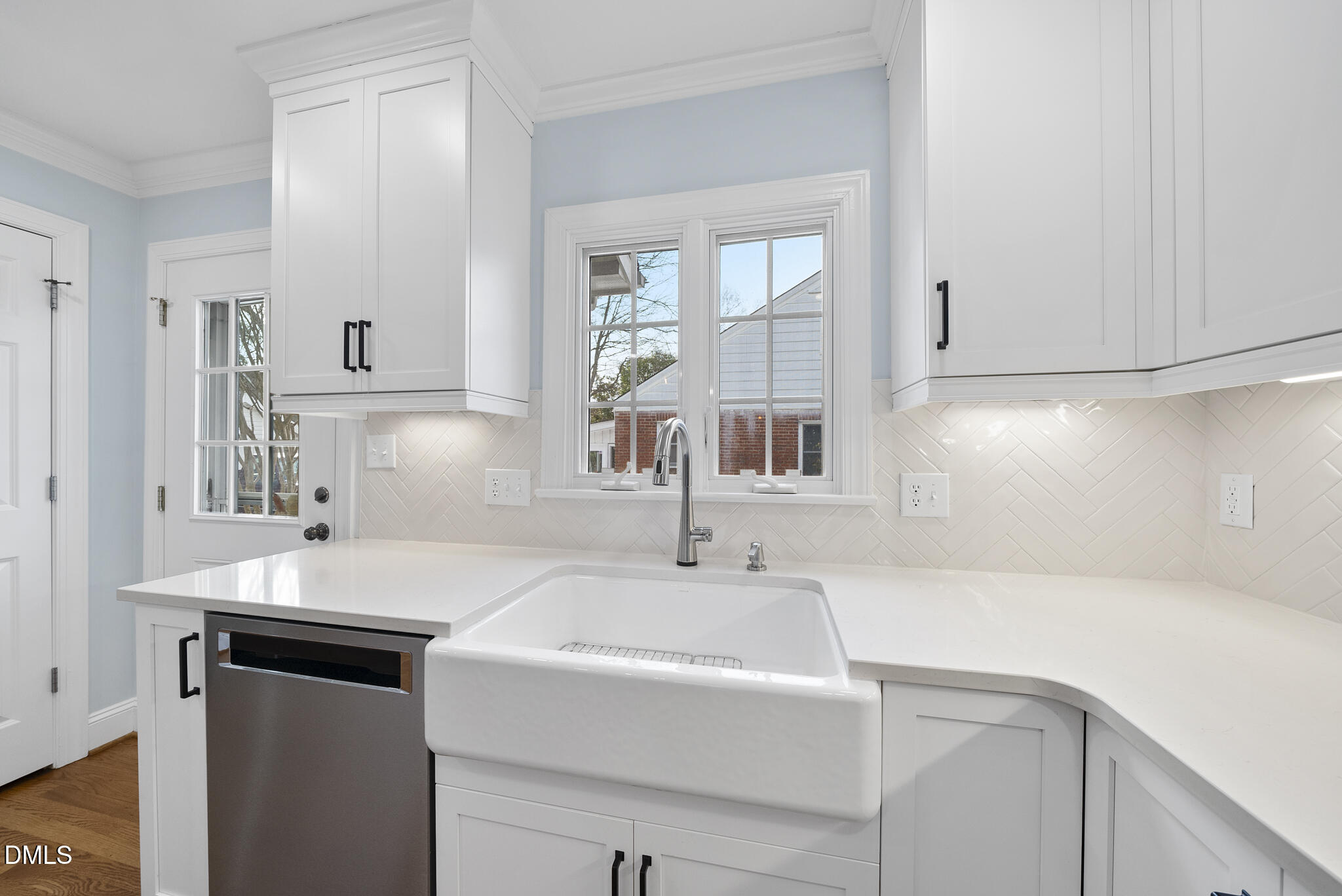 325 Morrison Avenue Raleigh, NC 27608 - Photo 11 of 42 a bathroom with a sink and a mirror