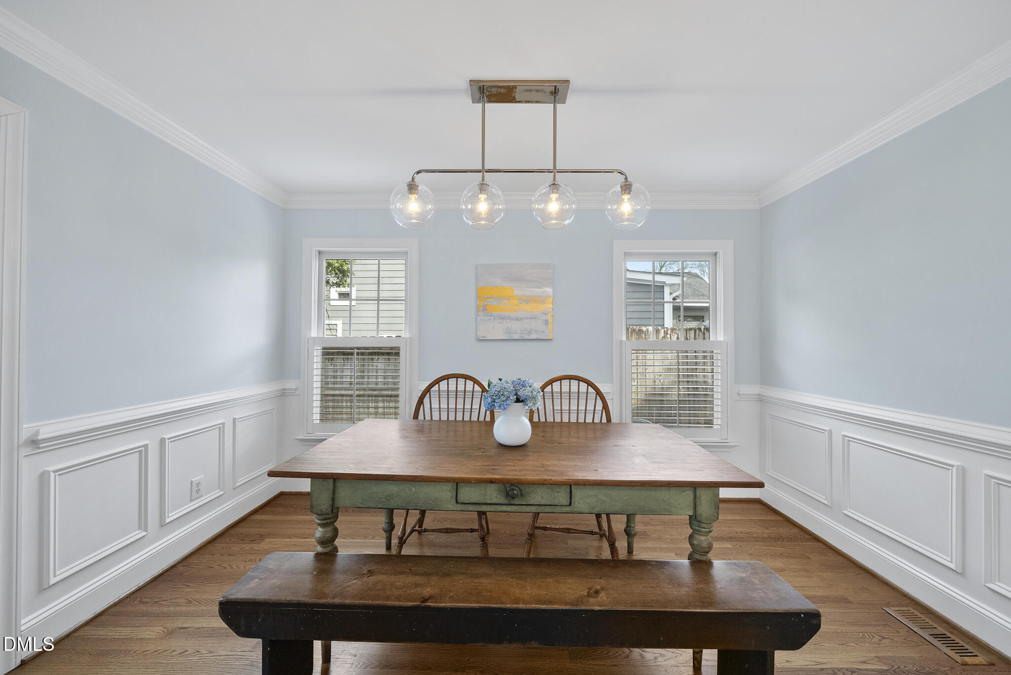 325 Morrison Avenue Raleigh, NC 27608 - Photo 13 of 42 a view of a dining room with furniture a rug and wooden floor