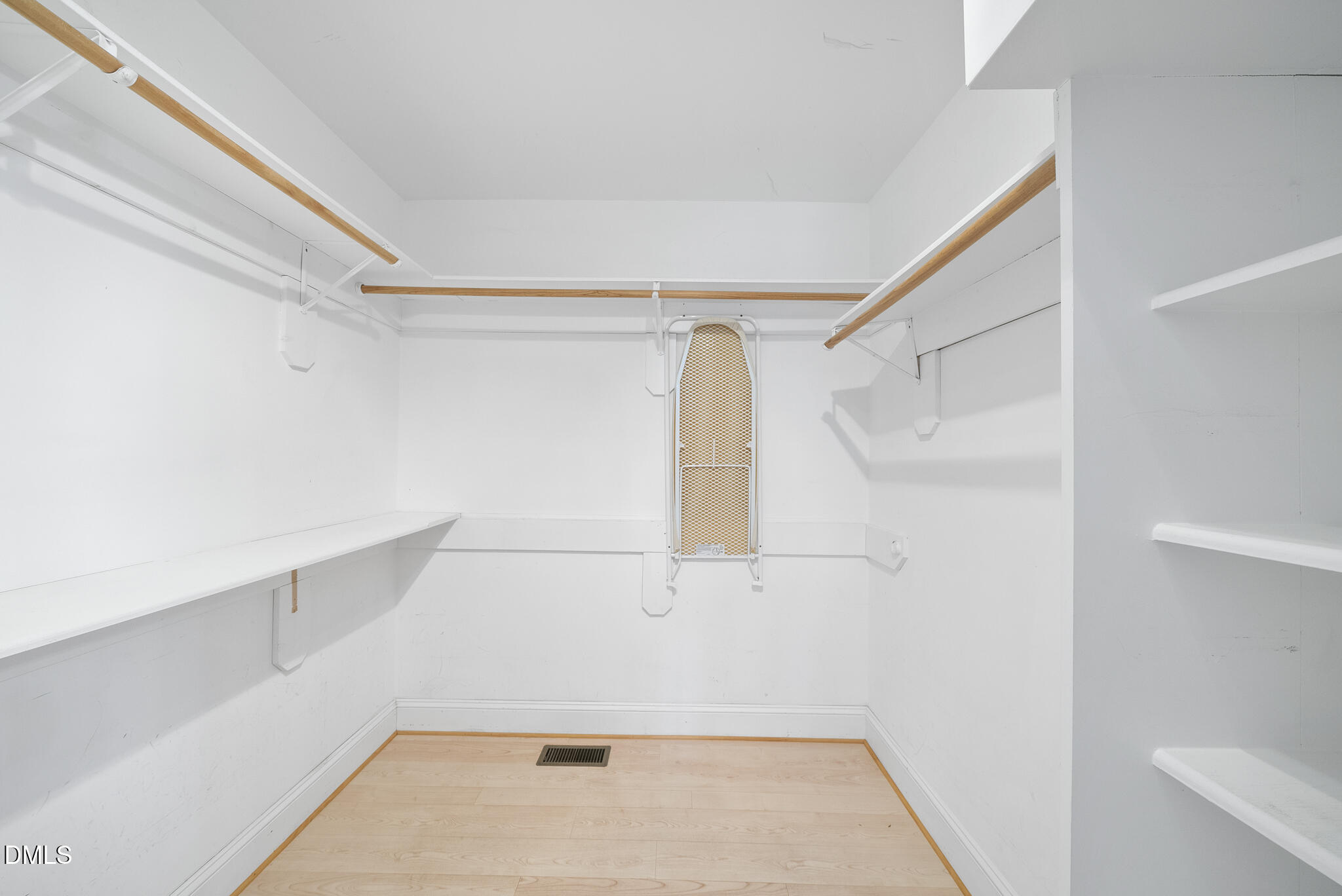 325 Morrison Avenue Raleigh, NC 27608 - Photo 20 of 42 a view of walk in closet with empty racks