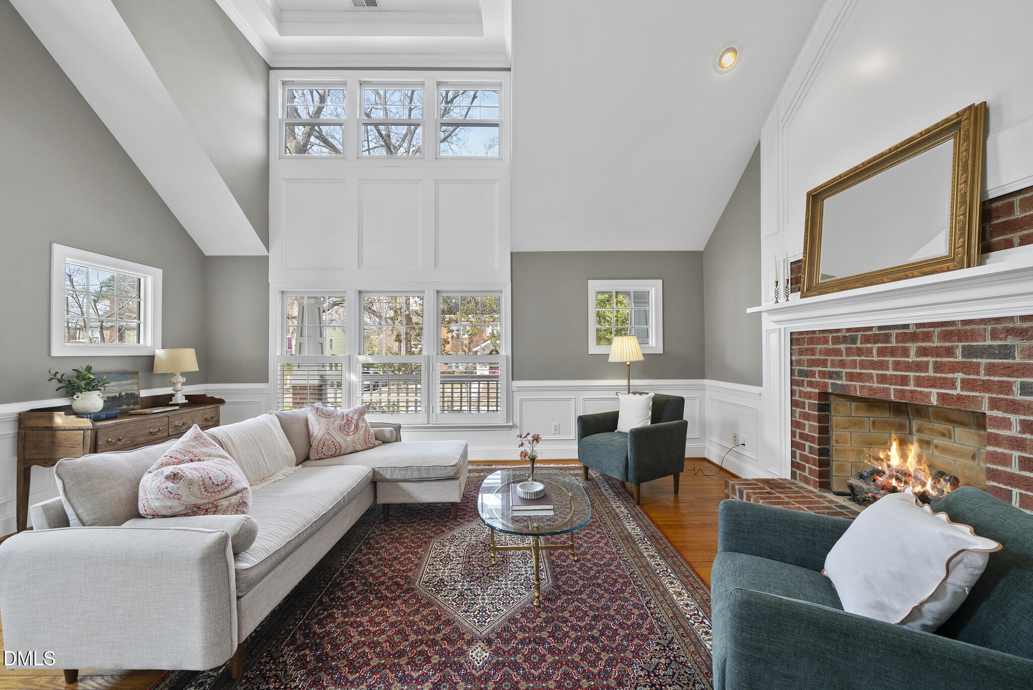 325 Morrison Avenue Raleigh, NC 27608 - Photo 2 of 42 a living room with furniture fireplace and a large window