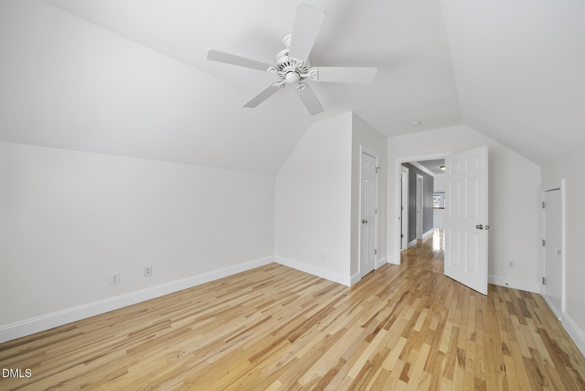 325 Morrison Avenue Raleigh, NC 27608 - Photo 31 of 42 a view of a room with wooden floor and ceiling fan