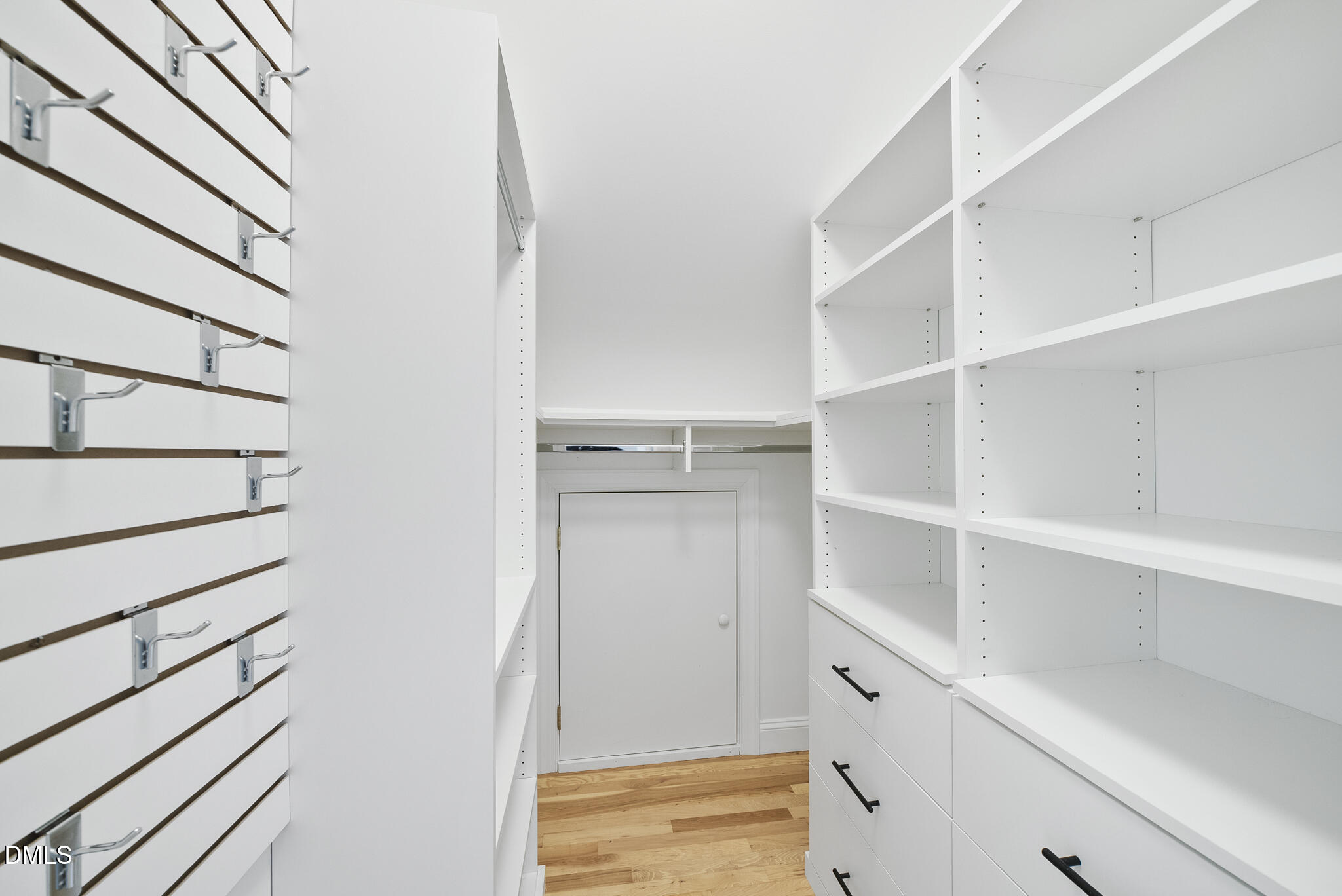 325 Morrison Avenue Raleigh, NC 27608 - Photo 32 of 42 a view of walk in closet with empty racks