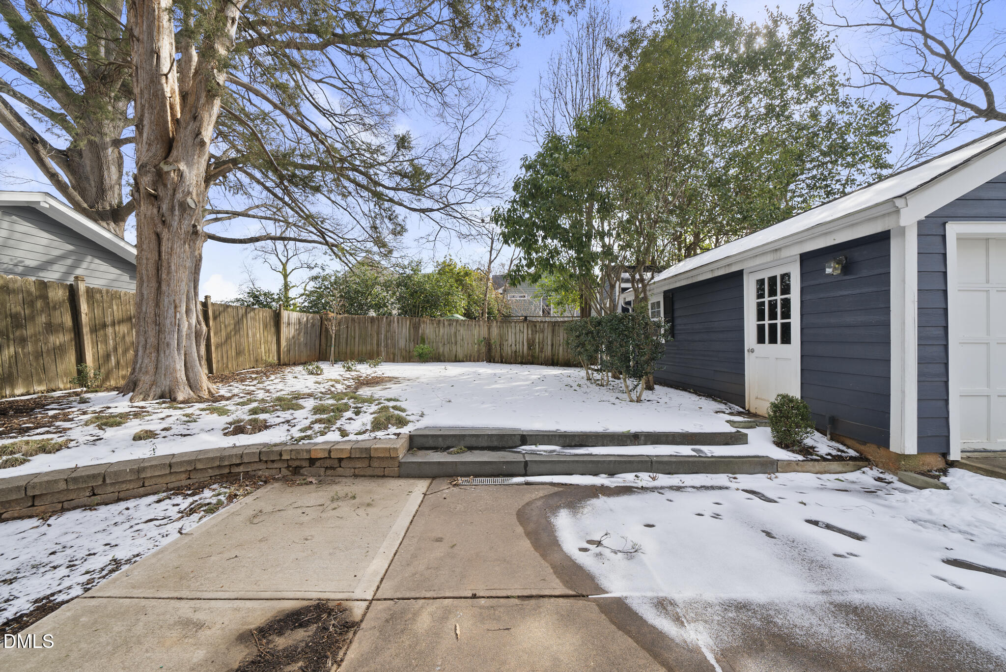 325 Morrison Avenue Raleigh, NC 27608 - Photo 36 of 42 a view of a yard with snow on the road