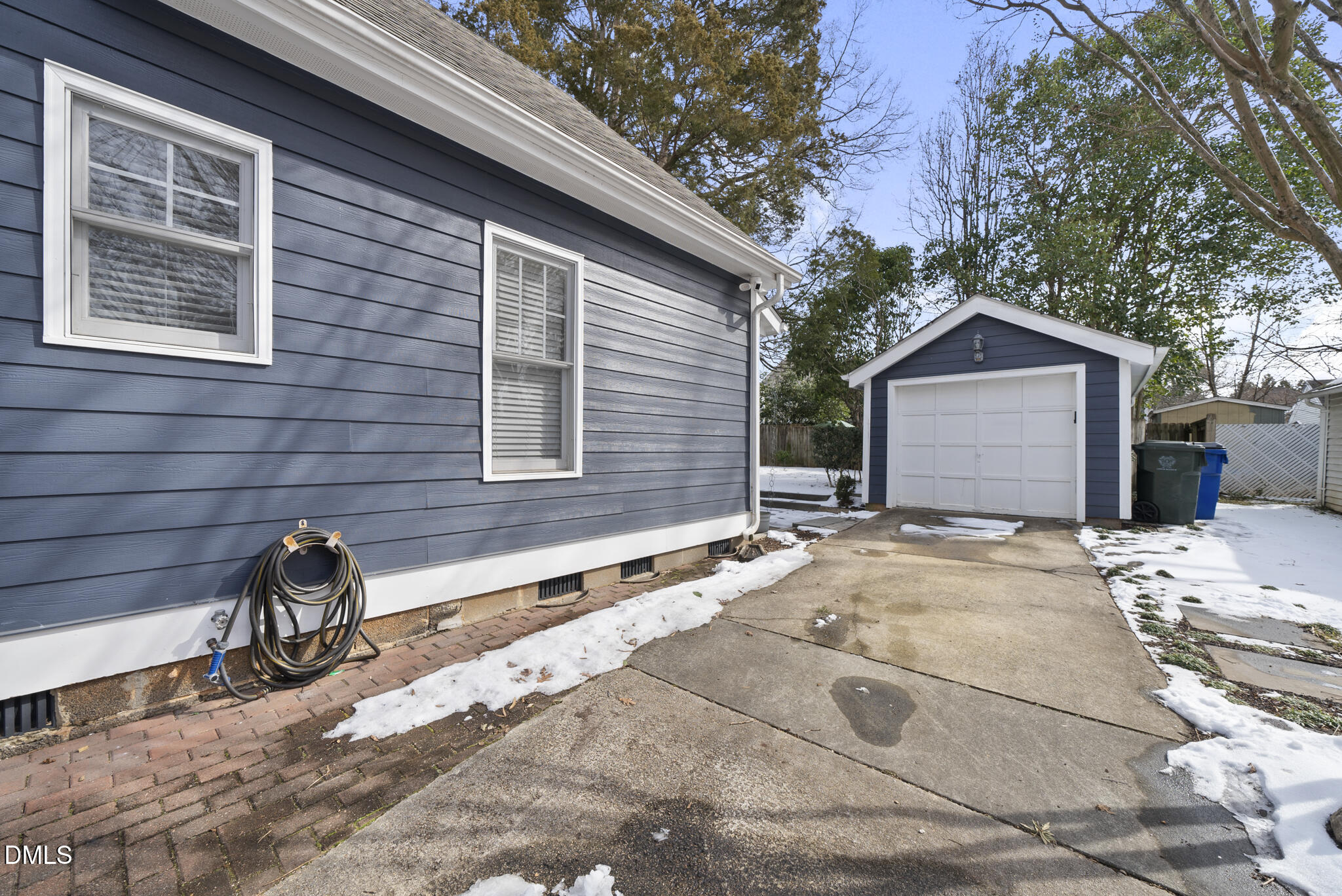325 Morrison Avenue Raleigh, NC 27608 - Photo 37 of 42 a front view of a house with a yard and garage