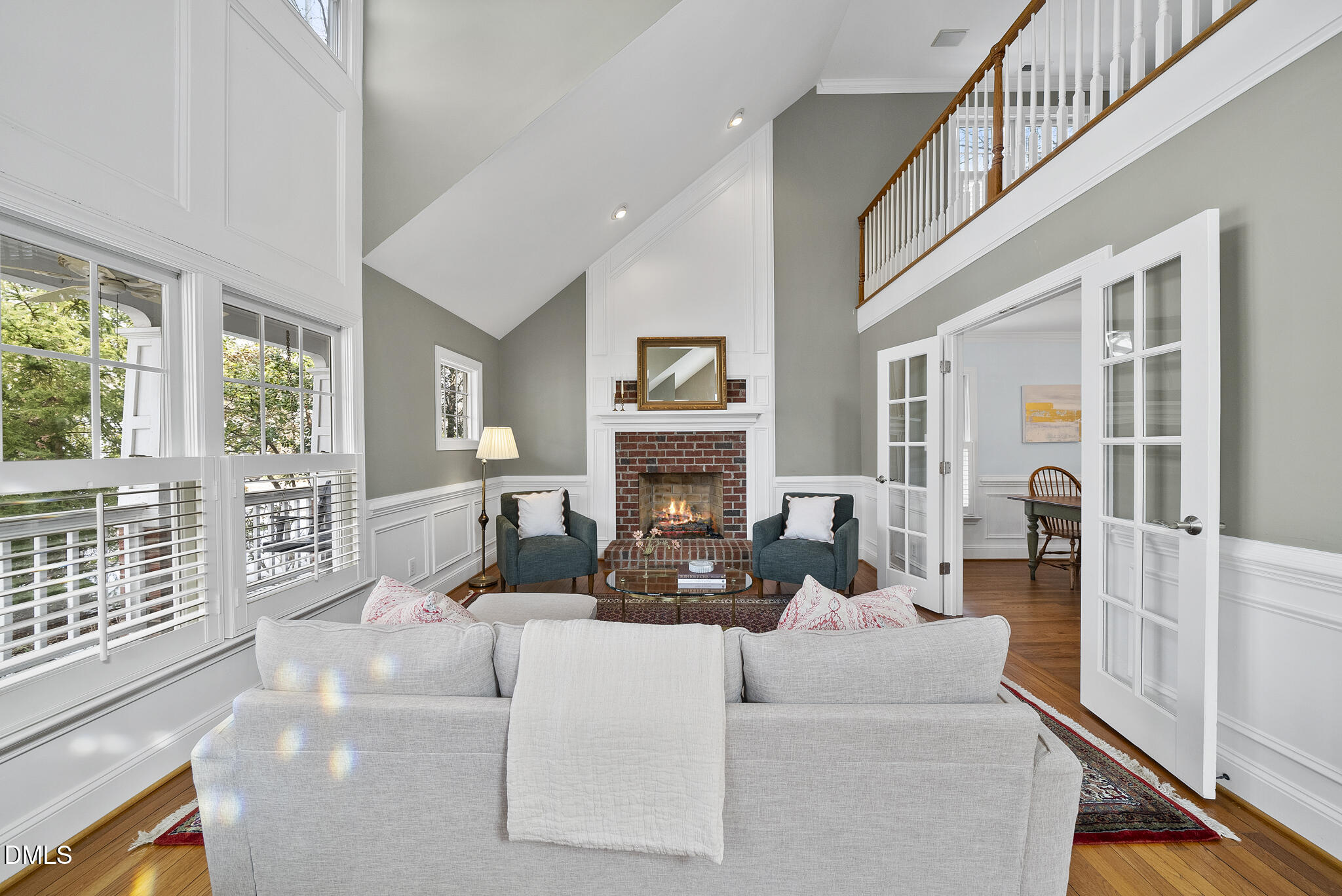 325 Morrison Avenue Raleigh, NC 27608 - Photo 3 of 42 a living room with furniture large window and a fireplace