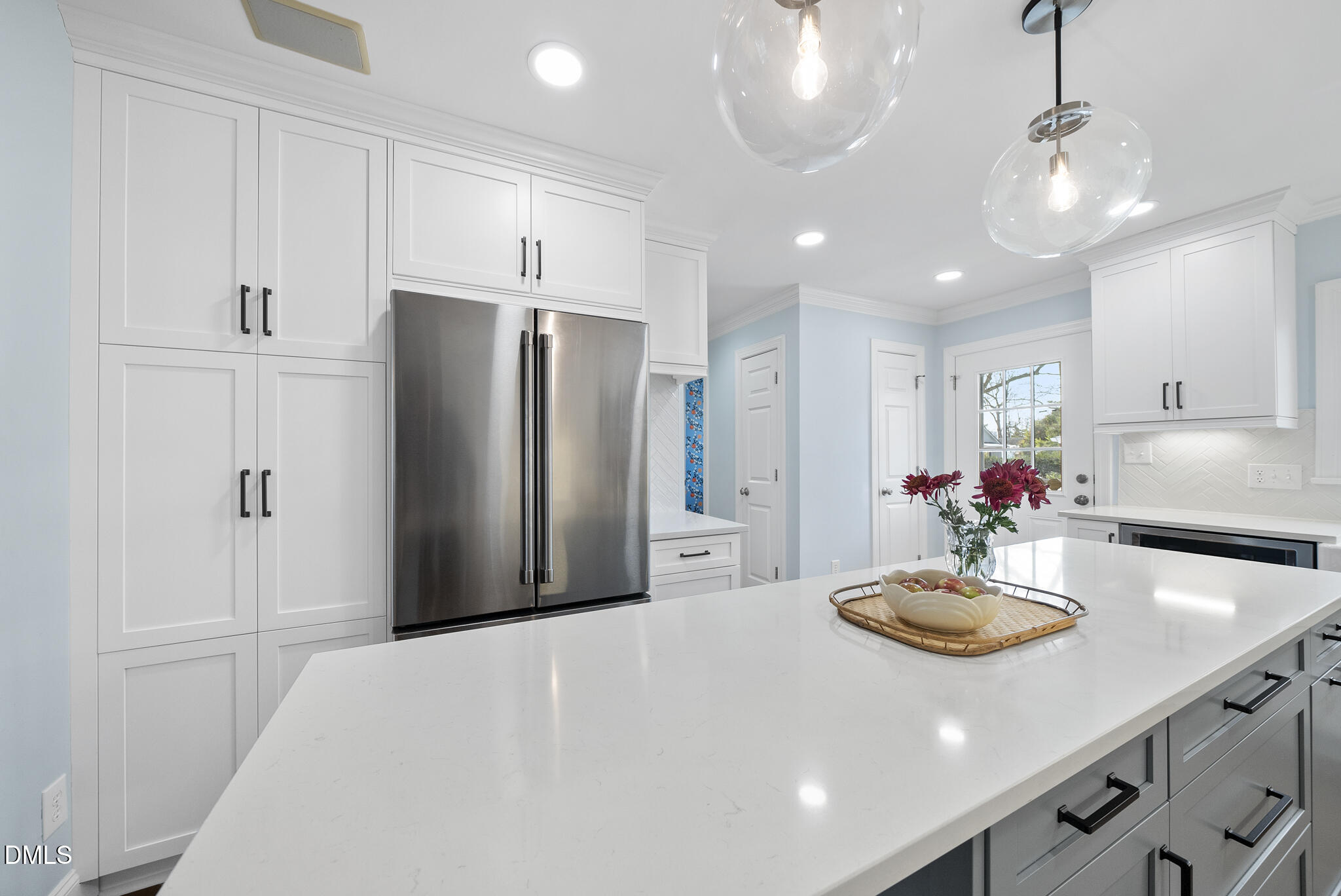 325 Morrison Avenue Raleigh, NC 27608 - Photo 8 of 42 a kitchen with refrigerator and cabinets