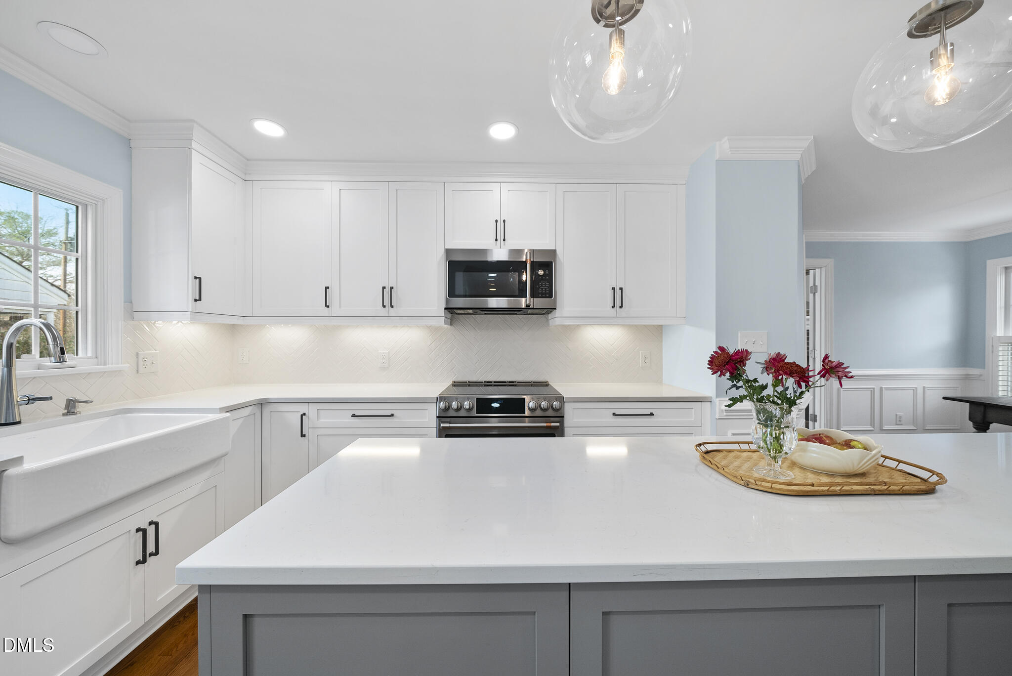 325 Morrison Avenue Raleigh, NC 27608 - Photo 9 of 42 a kitchen with a sink a stove and cabinets