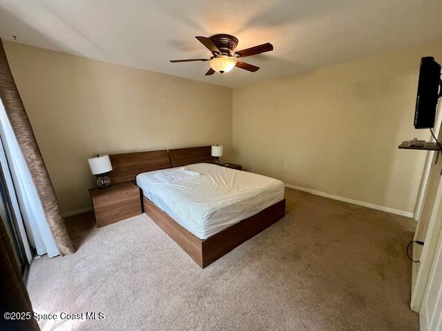 39 Piney Branch Way, Unit B Melbourne, FL 32904 - Photo 14 of 15 a living room with furniture and a flat screen tv