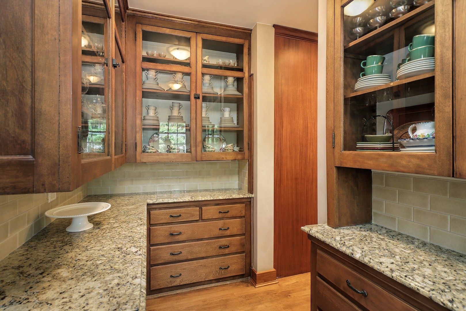 15 Old Green Bay Road Winnetka, IL 60093 - Photo 14 of 60 a bathroom with a granite countertop sink and a mirror