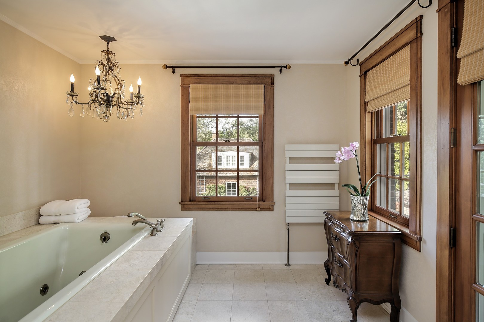 15 Old Green Bay Road Winnetka, IL 60093 - Photo 20 of 60 a bathroom with a tub sink and mirror