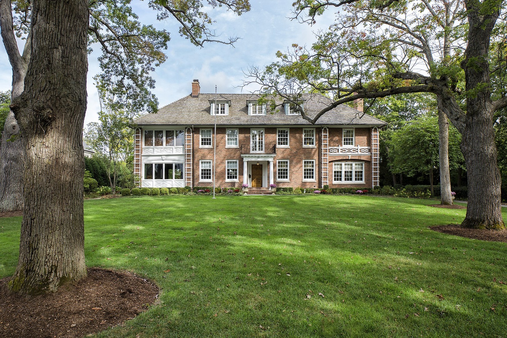 15 Old Green Bay Road Winnetka, IL 60093 - Photo 2 of 60 a view of a big house with a big yard and large trees