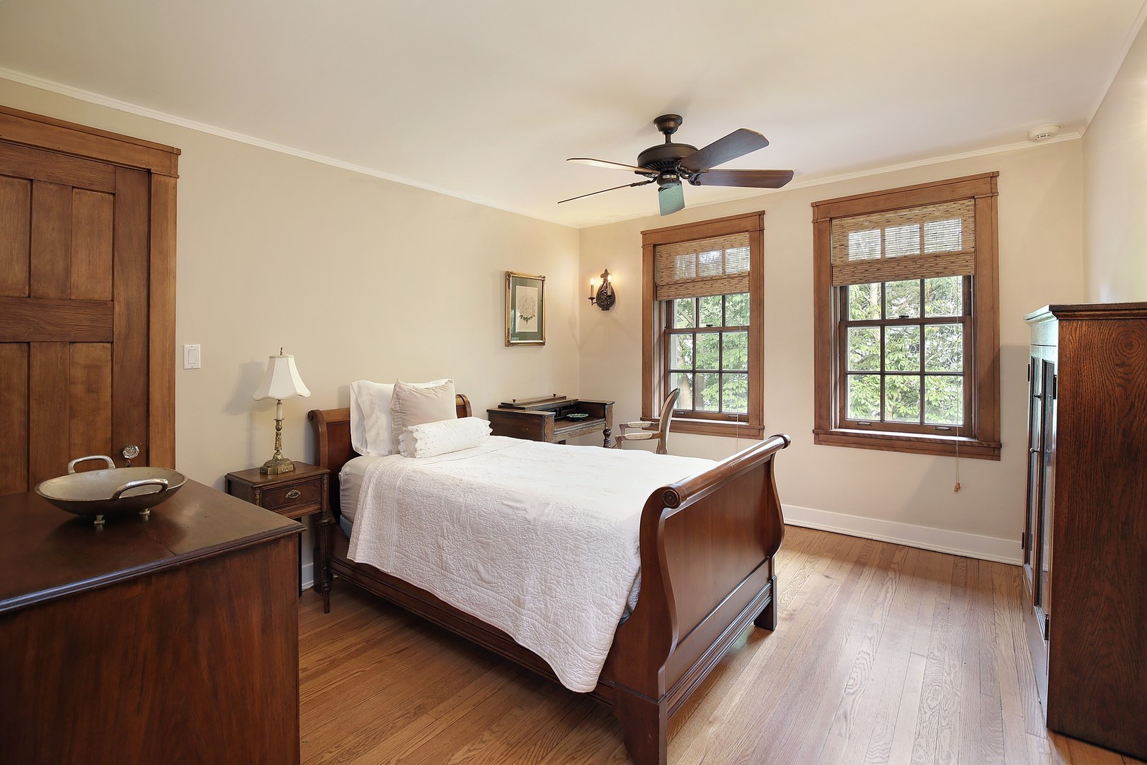 15 Old Green Bay Road Winnetka, IL 60093 - Photo 24 of 60 a spacious bedroom with a bed and a large window
